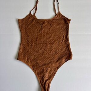 SKIMS brown bodysuit with logo pattern